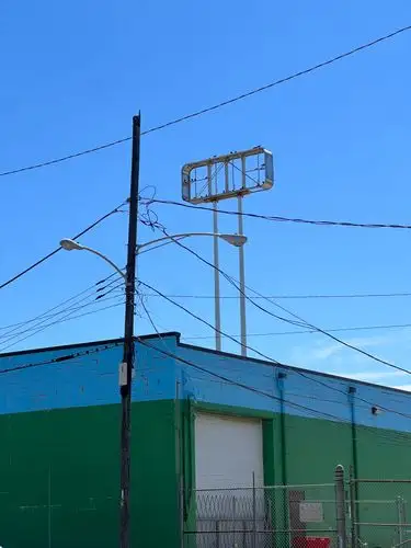 Vibrant urban geometry under a pristine blue sky.